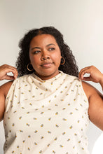 Load image into Gallery viewer, Woman wearing a white sleeveless top with small patterns against a plain background