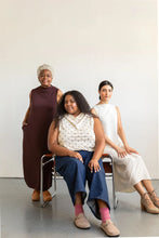 Load image into Gallery viewer, Three women sitting together against a white background