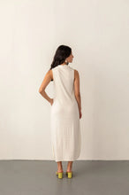 Load image into Gallery viewer, Woman wearing a white dress with a plain background