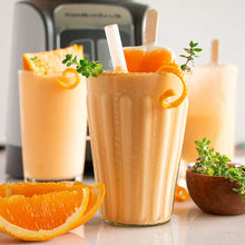 Load image into Gallery viewer, Orange smoothie with garnishes on a kitchen counter