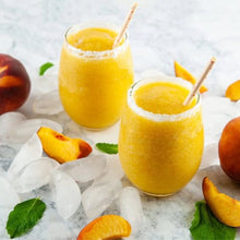 Load image into Gallery viewer, Two glasses of peach smoothie with ice and peaches on a light background