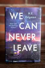 Load image into Gallery viewer, Book titled 'We Can Never Leave' by H.E. Edgmon with a purple cover and text.