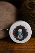 Load image into Gallery viewer, ferret holding yarn stitch measure