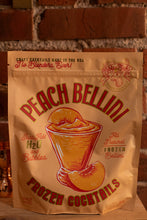 Load image into Gallery viewer, Peach Bellini frozen cocktails package with a brick wall background