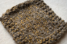 Load image into Gallery viewer, Close-up of a knitted fabric with a herringbone pattern on a light background