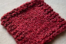 Load image into Gallery viewer, Red knitted fabric on a light background