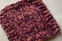 Load image into Gallery viewer, Close-up of a knitted fabric with a textured pattern on a neutral background