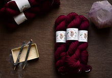 Load image into Gallery viewer, yarn hanks next to burning incense