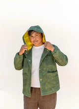 Load image into Gallery viewer, Person wearing a green hooded jacket on a white background