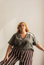 Load image into Gallery viewer, Person wearing a gray shirt and striped pants against a plain background