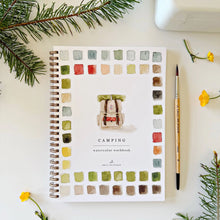 Load image into Gallery viewer, Camping watercolor workbook with color swatches on a white surface with decorative elements.