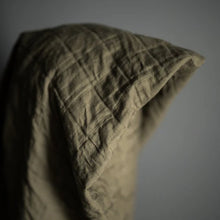 Load image into Gallery viewer, Quilted green fabric on a gray background