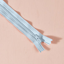 Load image into Gallery viewer, Metallic silver zipper on a pink background