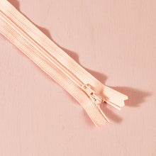 Load image into Gallery viewer, Close-up of a pink zipper on a matching pink background
