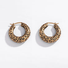 Load image into Gallery viewer, Pair of gold hoop earrings with leopard print pattern on a white background