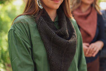 Load image into Gallery viewer, Woman wearing a green jacket and dark knitted scarf with blurred background