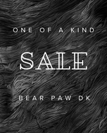 Black and white fur texture with 'One of a Kind Sale' text overlay