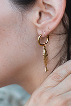Load image into Gallery viewer, Close-up of a person wearing a gold fish-shaped earring.