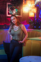 Load image into Gallery viewer, Woman posing in a bar with neon lights and decor