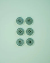 Load image into Gallery viewer, Five light blue buttons on a matching light blue background