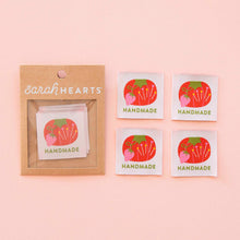 Load image into Gallery viewer, Packaging of 'Handmade' stickers by Sarah Hearts on a pink background