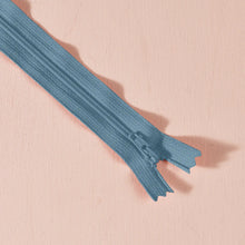 Load image into Gallery viewer, Blue zipper on a pink background