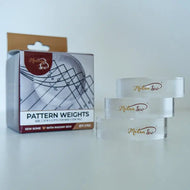 Pattern weights with packaging on a white background