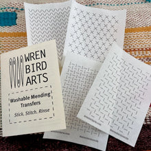Load image into Gallery viewer, Wren Bird Arts washable mending transfers with a branded card on a textured fabric background