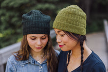 Load image into Gallery viewer, Two women wearing knitted hats outdoors with a blurred natural background