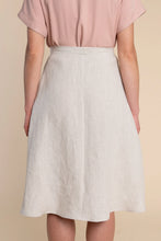 Load image into Gallery viewer, Person wearing a light pink top and beige skirt on a beige background