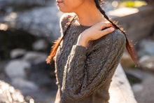 Load image into Gallery viewer, Person wearing a textured sweater with a blurred natural background