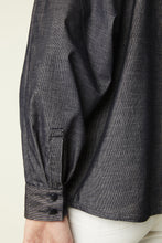 Load image into Gallery viewer, Close-up of a dark denim shirt with a beige background