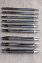 Load image into Gallery viewer, Nine metal knitting needles of different sizes arranged in a neat vertical stack on a light beige textured fabric background. Each needle has the brand name 'ChiapGoo' and its corresponding size printed on the shaft.