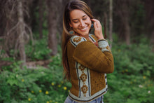 Load image into Gallery viewer, Woman wearing a patterned sweater in a forest setting