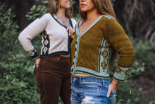 Load image into Gallery viewer, Two women wearing patterned sweaters standing outdoors with a blurred natural background