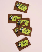 Load image into Gallery viewer, Five coasters with 'Hot Make' design on a pink background