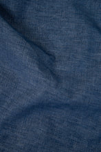 Load image into Gallery viewer, Close-up of blue fabric with a textured pattern