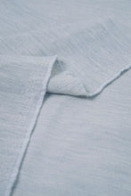 Load image into Gallery viewer, Close-up of light blue fabric with a textured pattern
