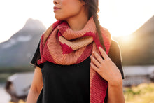 Load image into Gallery viewer, Woman wearing a colorful scarf with mountains in the background