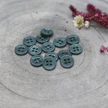 Load image into Gallery viewer, Green buttons on a textured gray surface with flowers