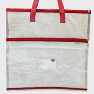 Mesh tote bag with red trim and handles on a light gray background