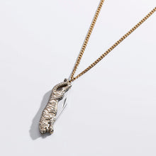 Load image into Gallery viewer, A gold chain necklace featuring a detailed silver tiger pendant, photographed on a clean white background with a soft shadow.