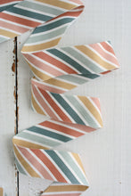 Load image into Gallery viewer, Colorful zigzag patterned fabric on a white background