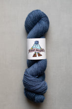 Load image into Gallery viewer, Blue skein of yarn with a label on a gray background