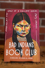 Load image into Gallery viewer, Book cover of 'Bad Indians Book Club' with a colorful illustration of a woman's face on a red background.