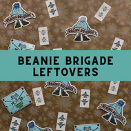 Beanie Brigade stickers on a patterned background with 'Beanie Brigade Leftovers' text.