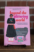 Load image into Gallery viewer, Book titled 'Beyond the Glittering World' on a stand with a blurred background