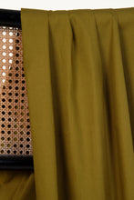 Load image into Gallery viewer, Green curtain fabric draped over a woven chair back