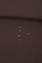 Load image into Gallery viewer, Water droplets on a brown fabric surface
