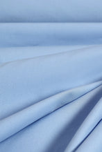 Load image into Gallery viewer, Close-up of light blue fabric with folds